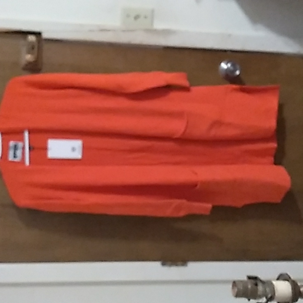 Apparis brand long orange sweater.  One size fits most
